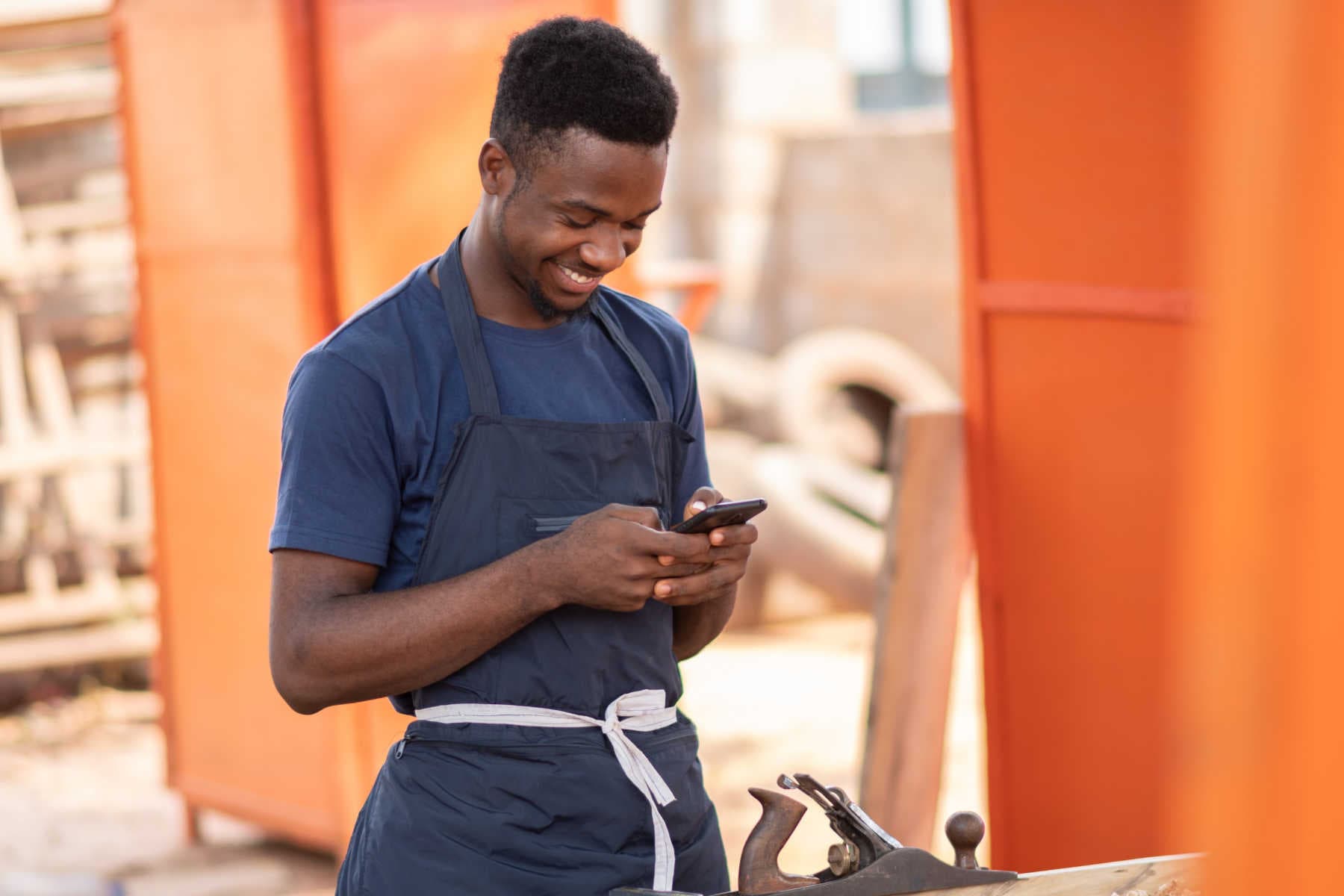 Man on his phone while working