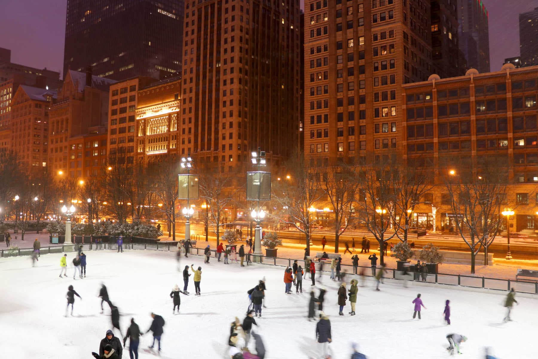 People ice skating in a public park