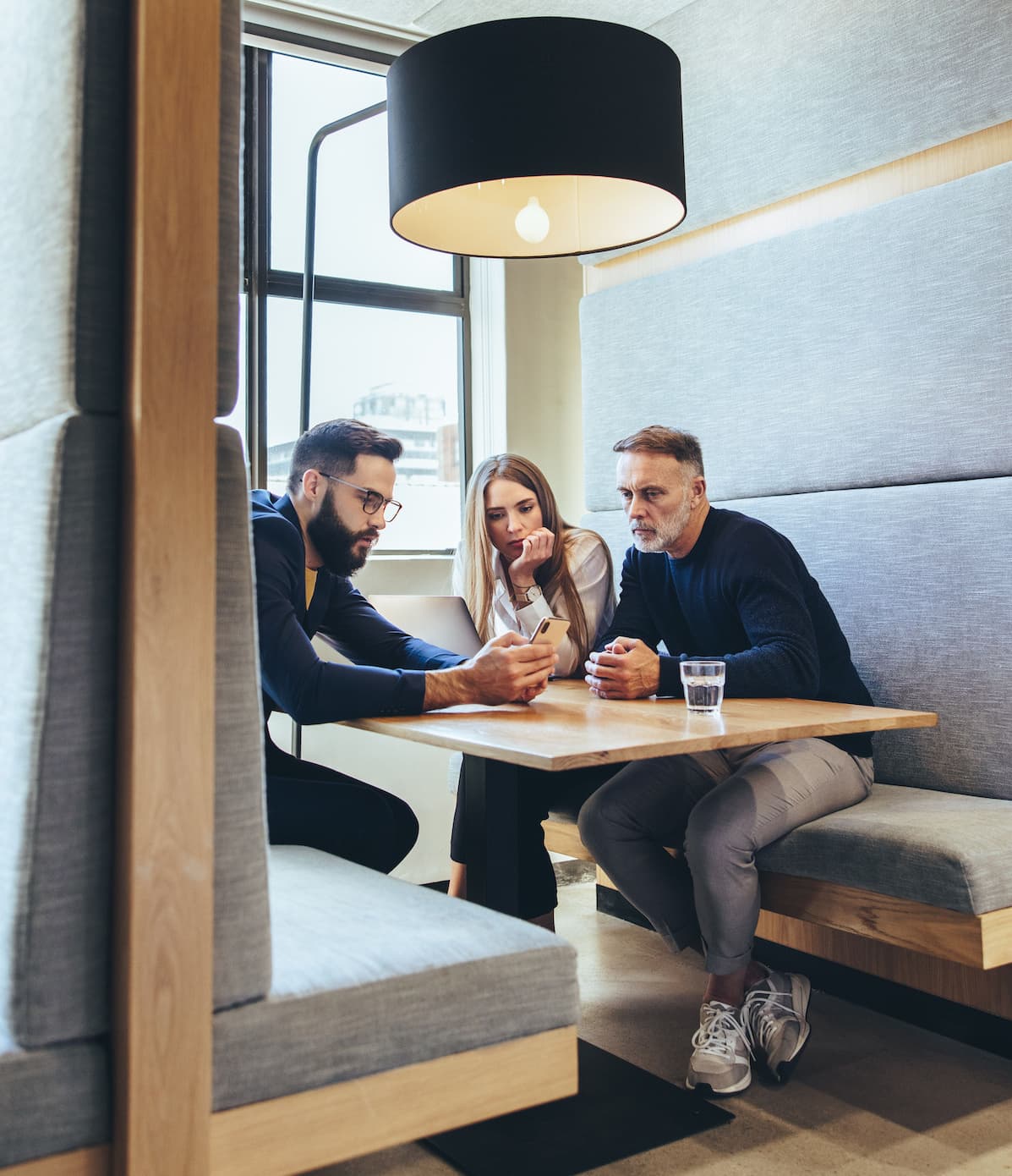 People working in a booth