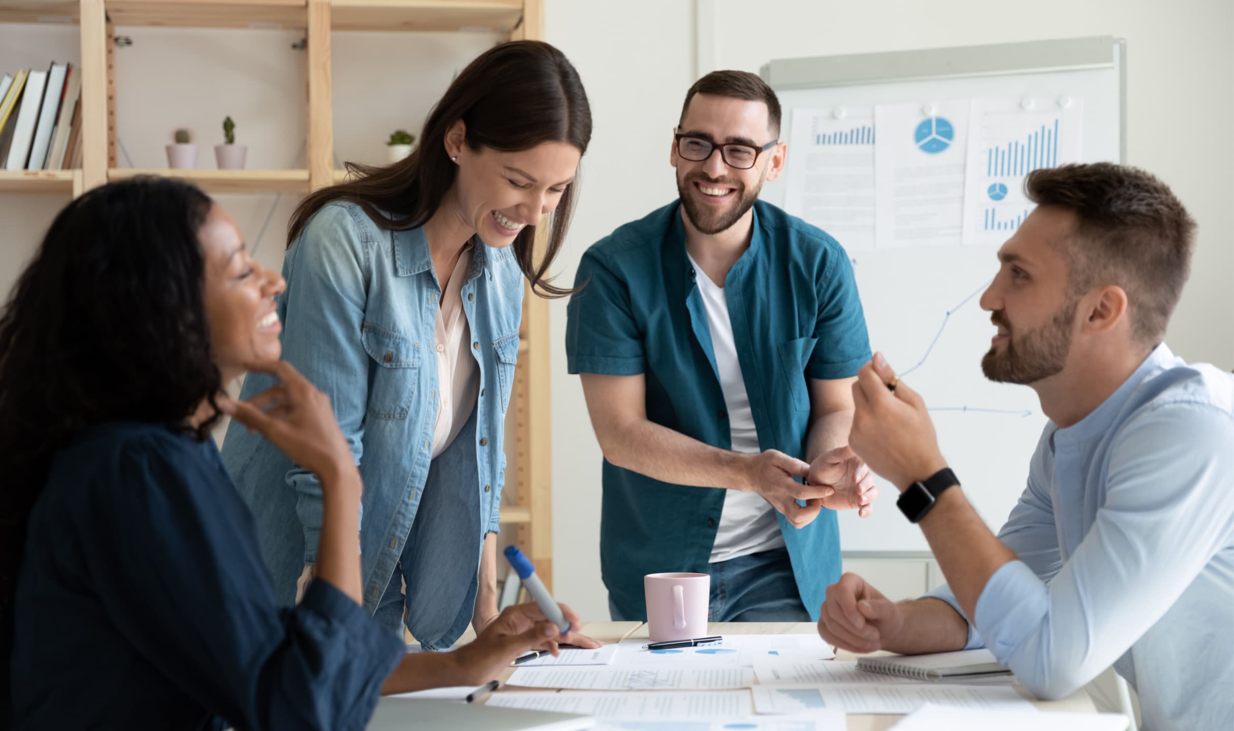 People smiling in a meeting.